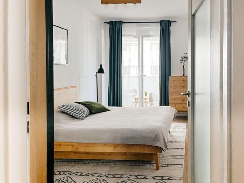Posteľ alebo postele v izbe v ubytovaní Apartamenty City Tower od WroclawApartament-pl