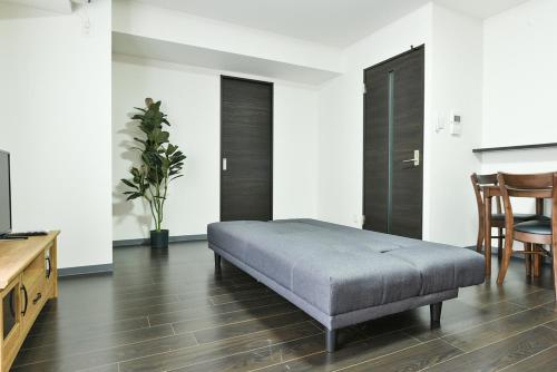 Postel nebo postele na pokoji v ubytování Sun Court Hongodori Garden Hills