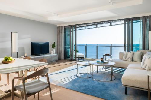 a living room with a view of the ocean at The Langham, Gold Coast and Jewel Residences in Gold Coast