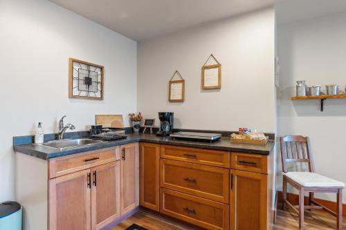 a kitchen with a sink and a counter top at Shawnigan Hills Guest Suite in Shawnigan Lake