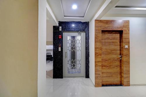 a hallway with a door in a room at Sun Inn Residency Rabale in Navi Mumbai