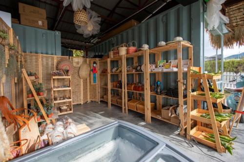 a store with wooden shelves and a bath tub at Stellar GoldenHill Cameron in Tanah Rata