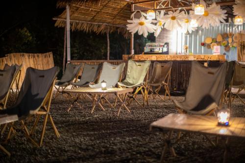 a group of chairs and a table with lights at Stellar GoldenHill Cameron in Tanah Rata