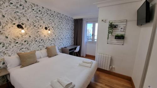 Postel nebo postele na pokoji v ubytování Hotel Norte