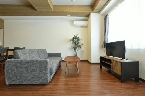 TV a/nebo společenská místnost v ubytování Hills Garden Hondori