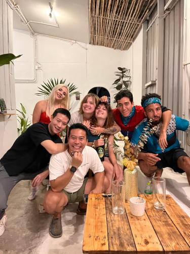 a group of people posing for a picture in a room at The PARK Society in Chiang Mai