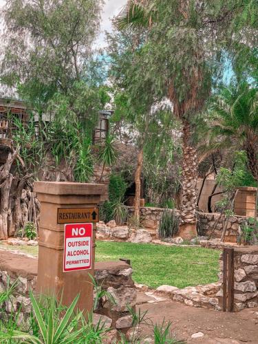a sign that says no offer anymore in a park at Nkisi Guesthouse in Kang
