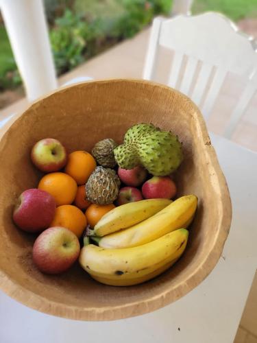 a bowl of fruits and vegetables on a table at Ginger Villa Somone in Somone