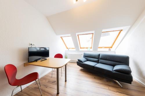 TV a/nebo společenská místnost v ubytování Pension Sonne Appartements