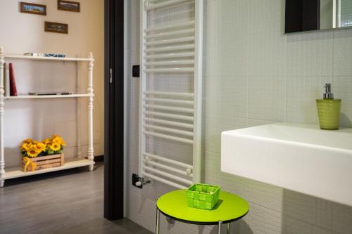 a room with a green table and a door at Incanto Toscano in Larciano