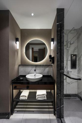 a bathroom with a sink and a mirror at Livro Hotel in Istanbul