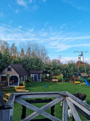 a view of a yard with a playground at Ostoja Karkonoska in Podgórzyn