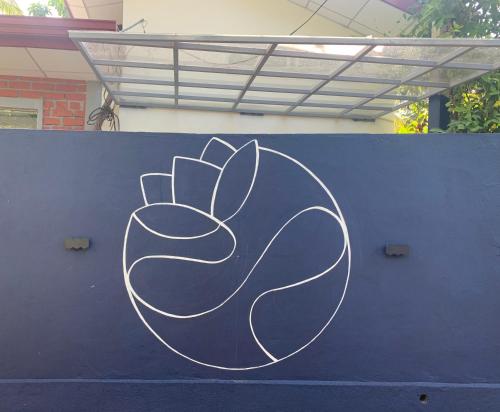 a drawing of a rabbit on a blue wall at Pranaya Hiriketiya in Hiriketiya