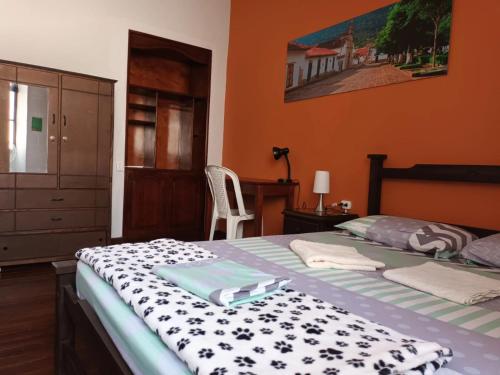 En eller flere senge i et værelse på Caracol Casa Turística