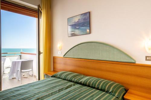 Postel nebo postele na pokoji v ubytování Hotel Splendid