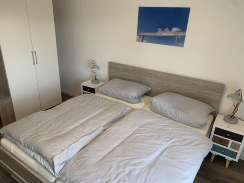 Una cama o camas en una habitación de Schillig, Nordsee - Friesland - Wohnung - neu