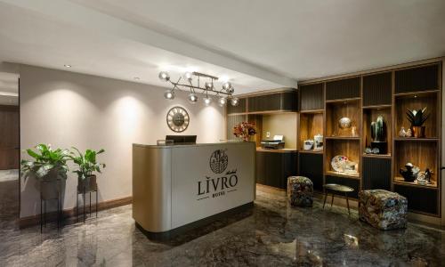 a lobby with a linyo store with plants and furniture at Livro Hotel in Istanbul
