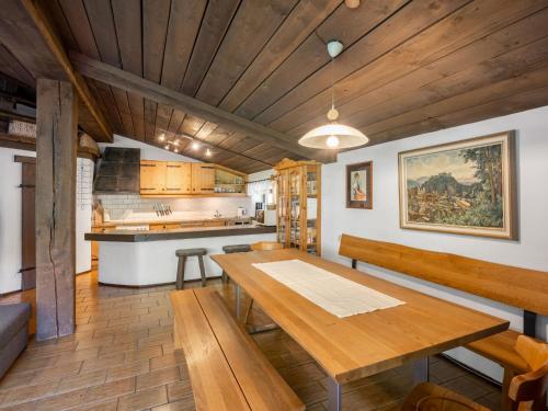 a dining room with a table and a kitchen at Apartment Schraudoplh by Interhome in Winklerdörfl