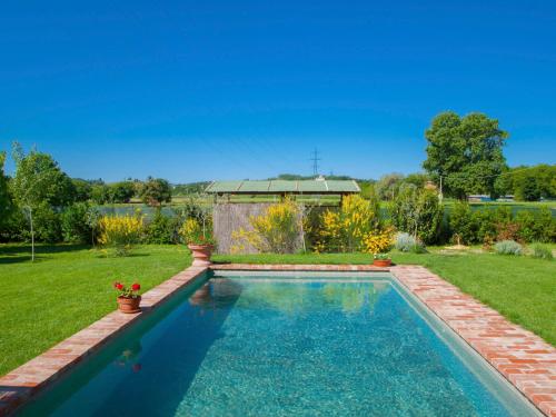 a swimming pool in the yard of a house at Holiday Home La Capannina by Interhome in La Croce