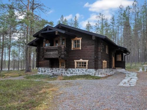 a log cabin in the middle of the woods at Holiday Home Siula by Interhome in Nissi
