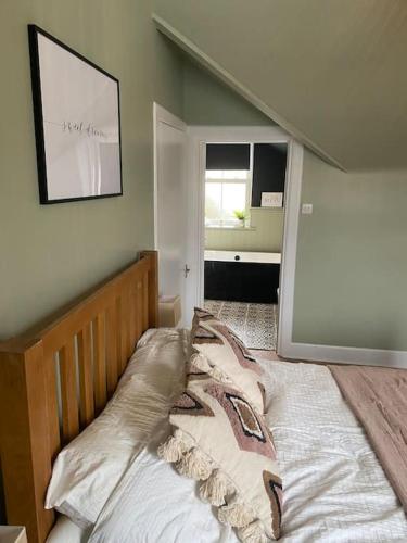 a bedroom with a bed in a room with a window at Frasers Apartment in Golspie