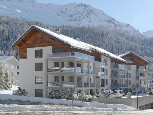 a apartment building with snow on the roof at Apartment Kulm 2 by Interhome in Valbella