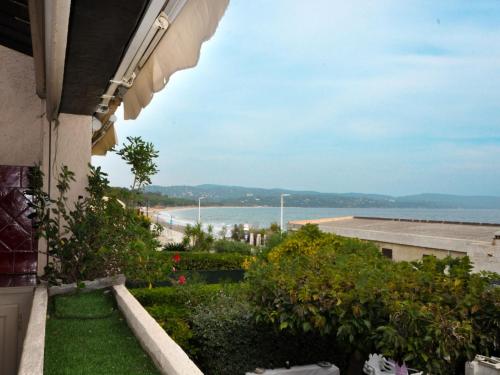 a view of the beach from a balcony of a building at Apartment Arius by Interhome in Cavalaire-sur-Mer