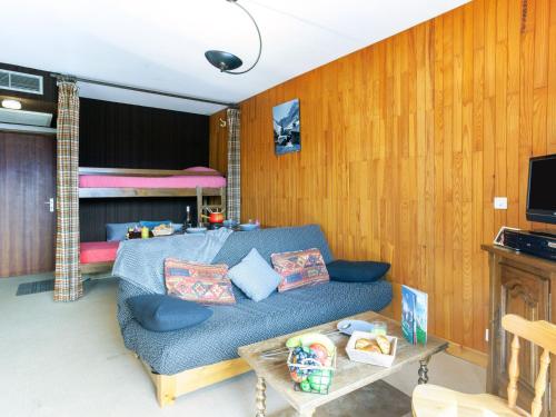 a living room with a couch and a bunk bed at Apartment Simiane by Interhome in La Toussuire