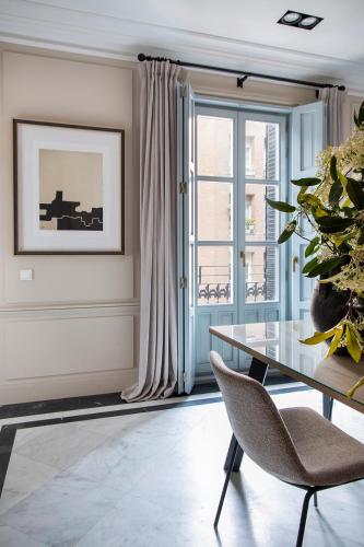 a dining room with a table and a window at Ayala 63 - THE ARC COLLECTION in Madrid