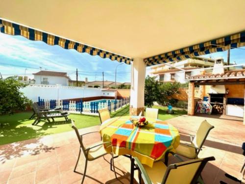 a patio with a table and chairs on a patio at Holiday Home Villa Anita by Interhome in Rincón de la Victoria