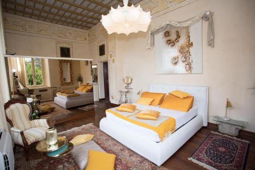 a bedroom with a bed and a living room at Villa Ghiringhelli in Azzate