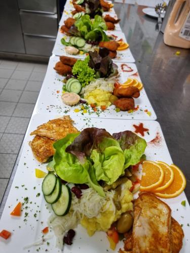 a row of plates of food on a table at Haiminger Hof in Haiming