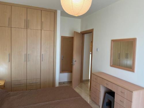 a bedroom with a bed and a fireplace and a mirror at Seaview apartment with roof terrace in Kalecik