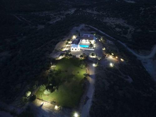 an aerial view of a house at night with lights at Finca El Jaral in Santa Elena