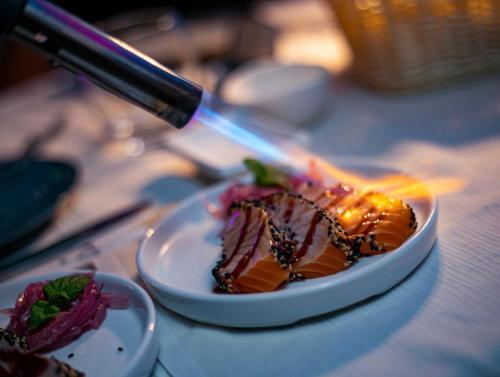 a plate of food on top of a table at La Bussola Hotel Calabria in Capo Vaticano
