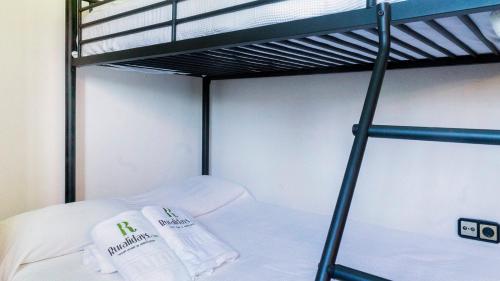 a bunk bed with two towels on top of it at Villa Fructus Vejer de la Frontera - El Palmar by Ruralidays in Cádiz