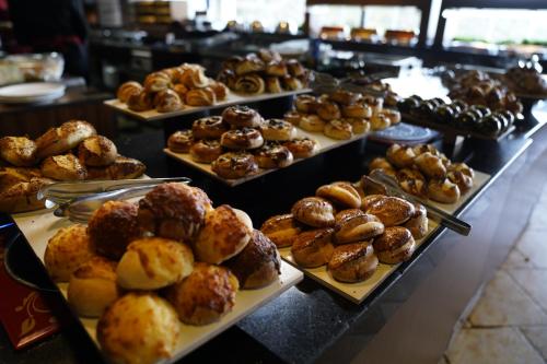 a bunch of pastries on trays in a bakery at Manaspark Deluxe Hotel in Oludeniz