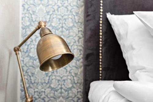 Un ou plusieurs lits dans un hébergement de l'établissement Donners Hotell