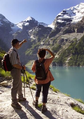 a man and a woman standing on top of a mountain at Toni's Alpine Loft & SPA in Kandersteg