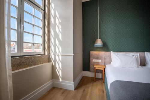 Un ou plusieurs lits dans un hébergement de l'établissement Boemio FLH Hotels