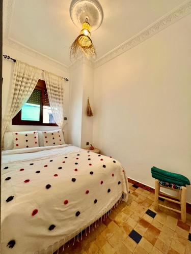 a bedroom with a bed with red hearts on it at DAR ADIL KASBAH in Tangier