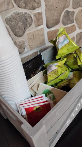 a white drawer filled with food and plates at Casa Vacanza Giorgia 2.0 in Marino