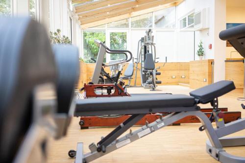 a gym with two treadmills and a treadmill at Park Hotel Laim in Munich