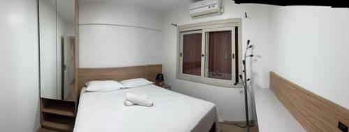 Un pat sau paturi într-o cameră la Apartamento da Rua Coberta