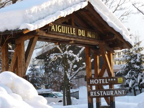 a sign for a hotel in the snow at Aiguille du Midi - Hôtel & Restaurant in Chamonix-Mont-Blanc