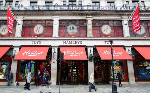 people walking in front of a store with red awnings at Astor Court Hotel in London