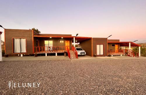 a house with a car parked in front of it at ELUNEY Combarbala in Combarbalá