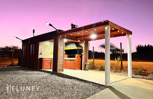 a small building with a roof and a street light at ELUNEY Combarbala in Combarbalá