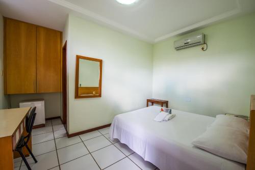 Postel nebo postele na pokoji v ubytování Hotel Metropolitano