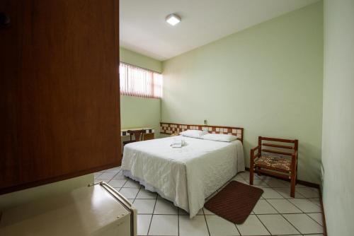 Postel nebo postele na pokoji v ubytování Hotel Metropolitano